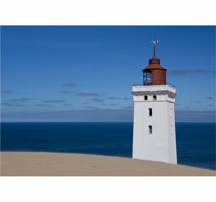Foto behang bergen vuurtoren bij de oceaan - TenStickers