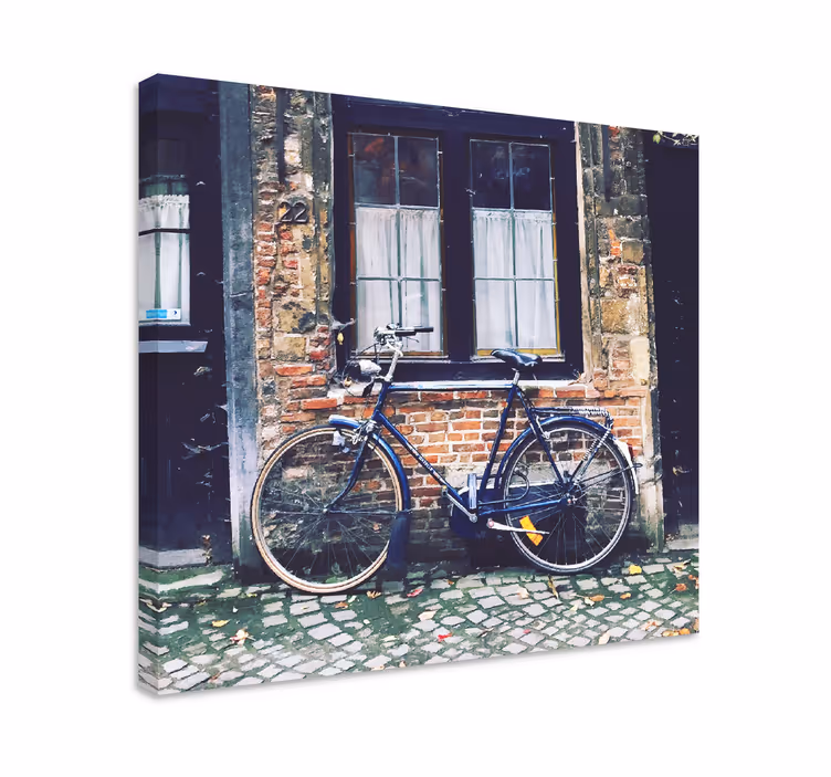 Canvas schilderij landen en steden fiets bij baksteen - TenStickers