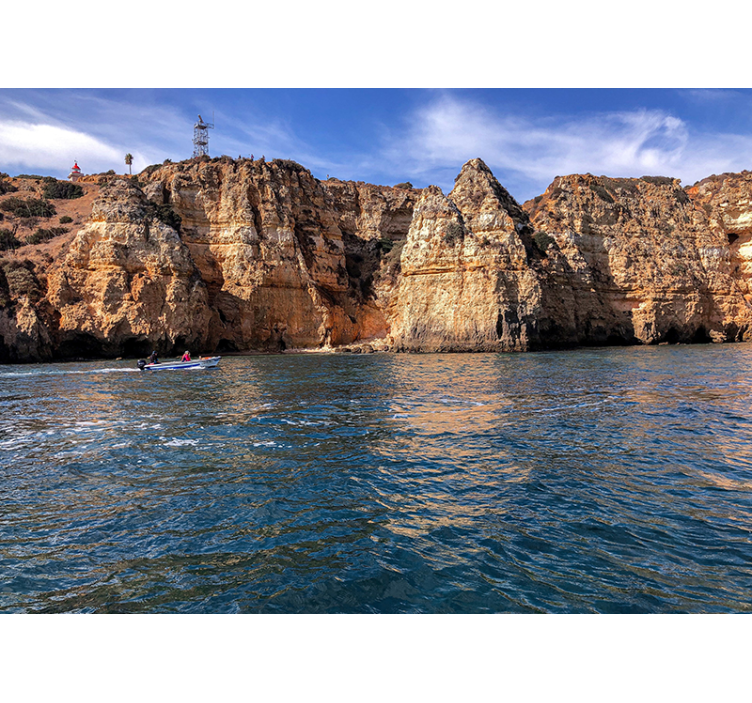 Rotsstructuur aan zee fotobehang landschap - TenStickers
