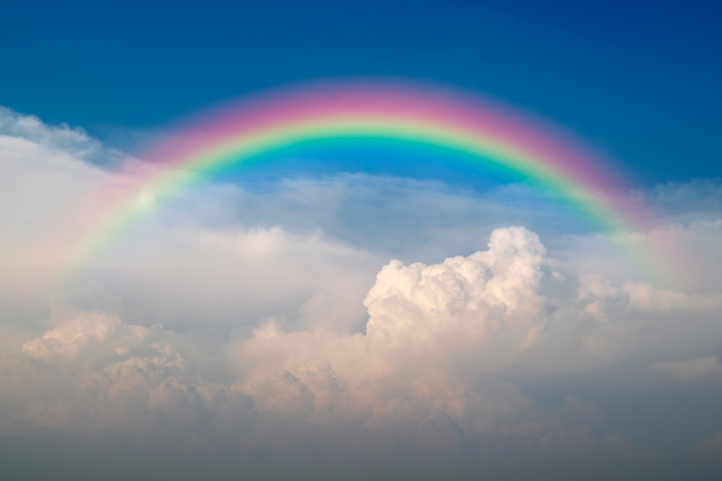 Regenboog poster met wolken - TenStickers