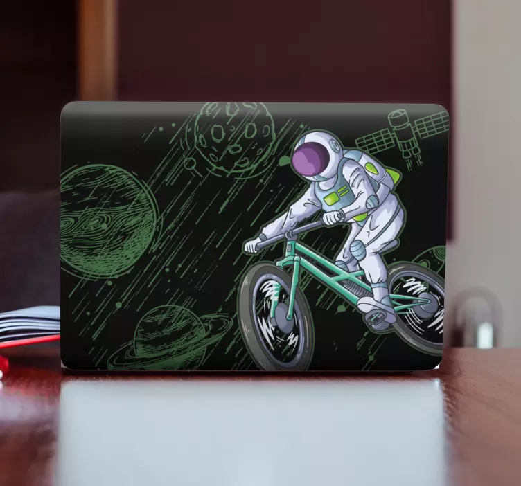 Laptop sticker astronaut op fiets - TenStickers