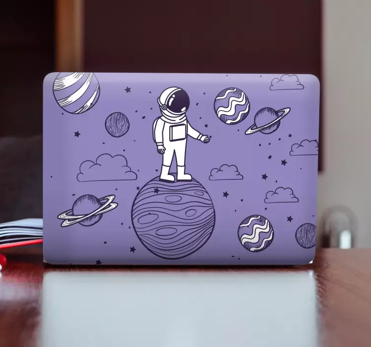 Astronaut op planeet laptop sticker - TenStickers